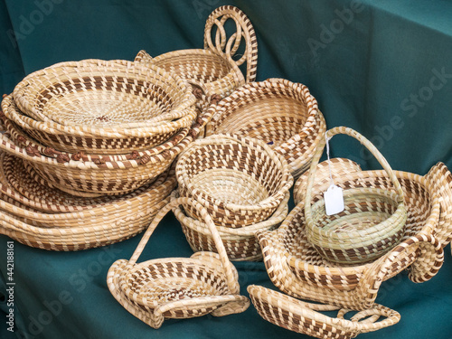 pile of handcrafted sweet grass baskets for sale photo