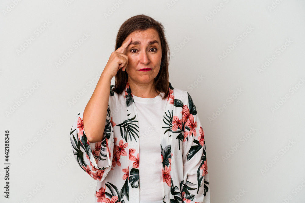 Middle age caucasian woman isolated on white background pointing temple with finger, thinking, focused on a task. Middle age caucasian woman isolated on white background pointing temple with finger, thinking, focused on a task.