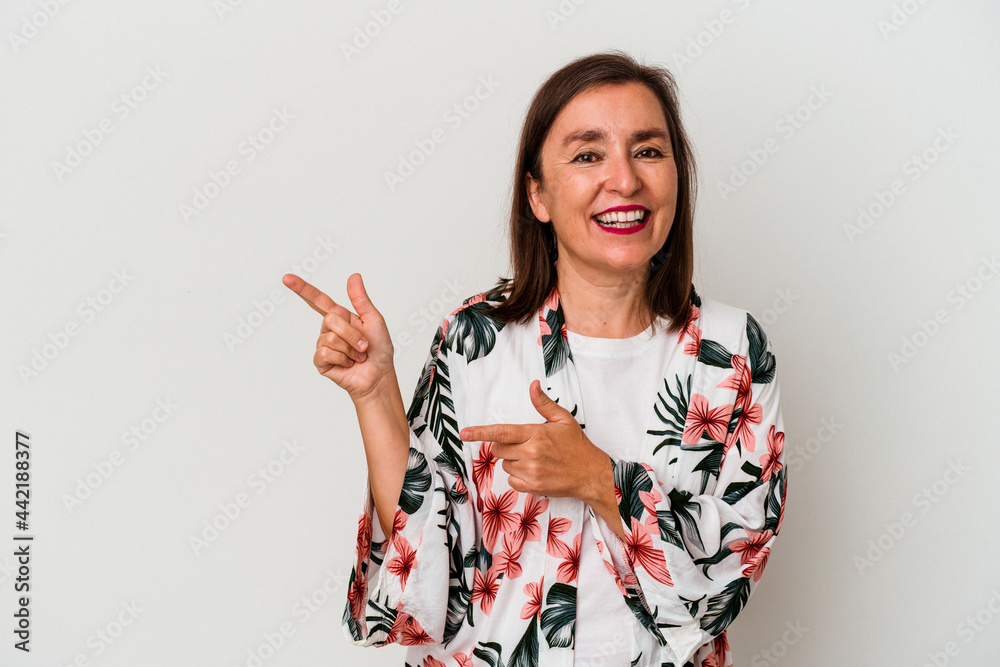 Middle age caucasian woman isolated on white background excited pointing with forefingers away. Middle age caucasian woman isolated on white background excited pointing with forefingers away.