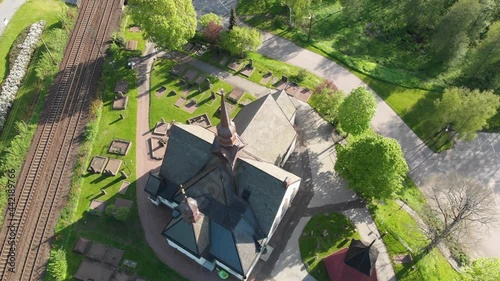 Aerial Drone Footage of Church and Graveyard in Lerum, Town in Vastra Gotaland, Sweden. photo