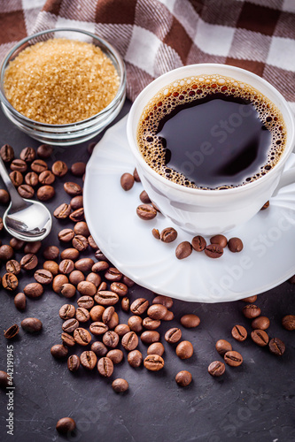 cup of fragrant fresh coffee on a dark stone background