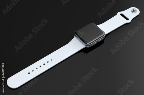 Stainless silver smart watch or fitness tracker isolated on black background.
