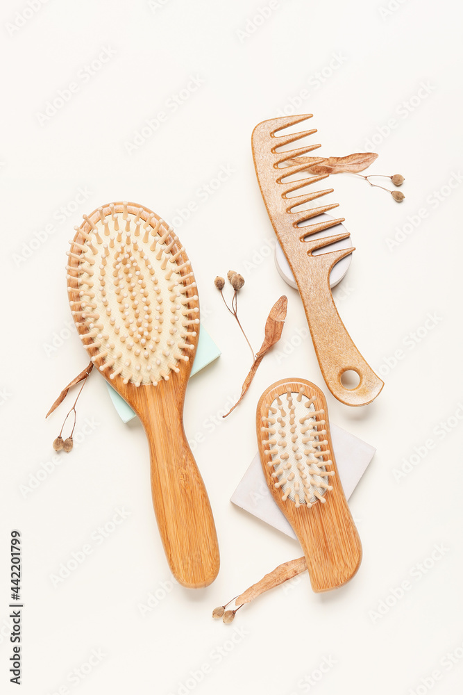 Hair brushes and comb on color background - obrazy, fototapety, plakaty 