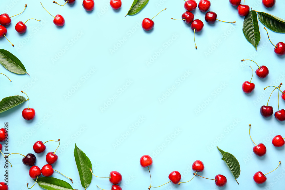 Frame made of tasty ripe cherry on color background Frame made of tasty ripe cherry on color background