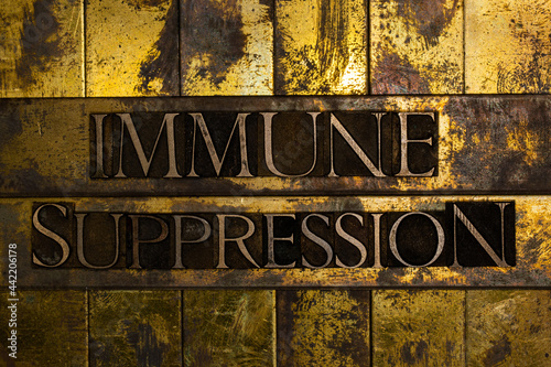 Immune Suppression text on vintage textured grunge copper and gold background