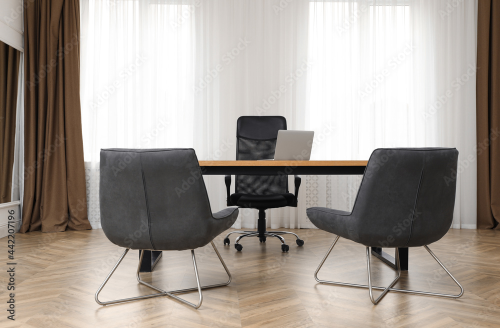 Director's office with large wooden table and comfortable armchairs. Interior design Director's office with large wooden table and comfortable armchairs. Interior design
