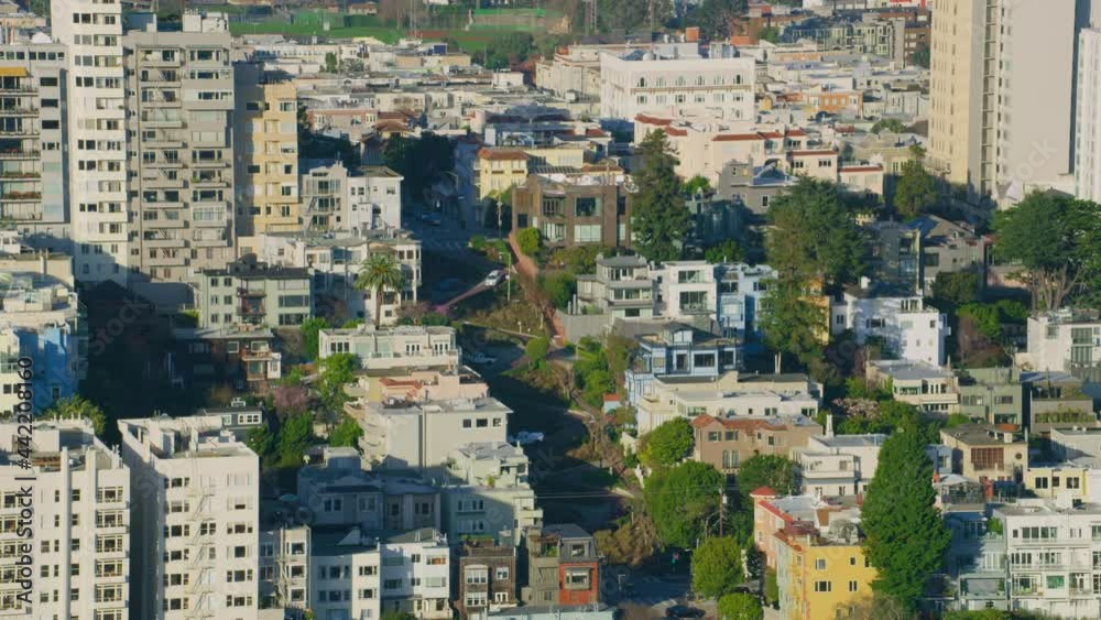 Aerial view of Lombard Street. Famous crooked street with eight hairpin turns. Several buildings located in Russian Hill an upscale residential neighborhood. San Francisco, California. US. Shot in 8K. Aerial view of Lombard Street. Famous crooked street with eight hairpin turns. Several buildings located in Russian Hill an upscale residential neighborhood. San Francisco, California. US. Shot in 8K.