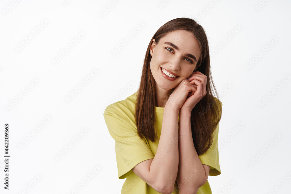 So adorable. Beautiful girl enjoying view, looking at beauty, admire and contemplate smth, leaning on hands and smiling happy, standing against white background So adorable. Beautiful girl enjoying view, looking at beauty, admire and contemplate smth, leaning on hands and smiling happy, standing against white background