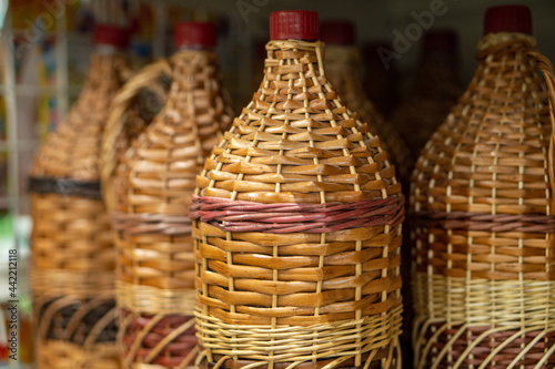 bottles, wine jugs, jars braided with rattan wood vine