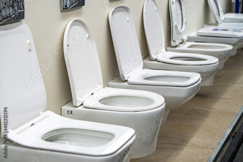 Lot of white toilets in hardware store, plumbing department