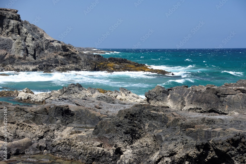 yhe waves crashing on the rocks yhe waves crashing on the rocks