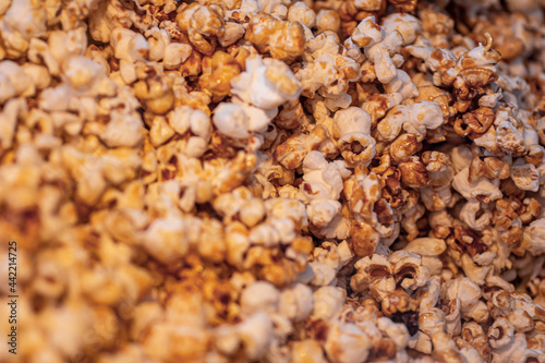 homemade caramel sweet popcorn as a detailed close-up shot, selective focus.