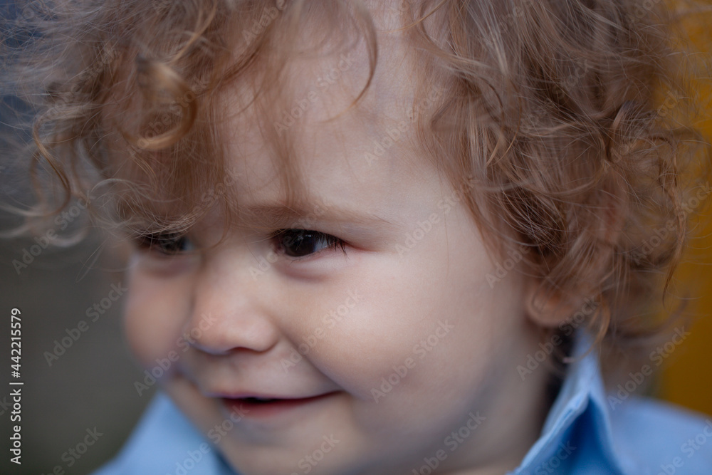 Portrait of a happy laughing child. Close up positive baby kids face. Smiling infant, cute smile. Portrait of a happy laughing child. Close up positive baby kids face. Smiling infant, cute smile.
