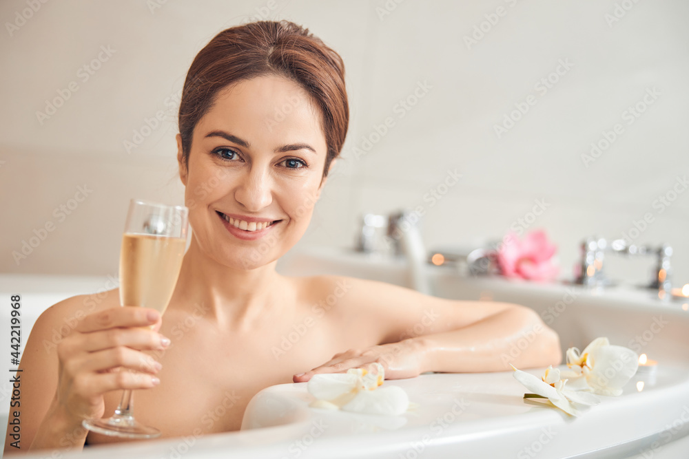 Young Caucasian woman resting with a drink at home Young Caucasian woman resting with a drink at home
