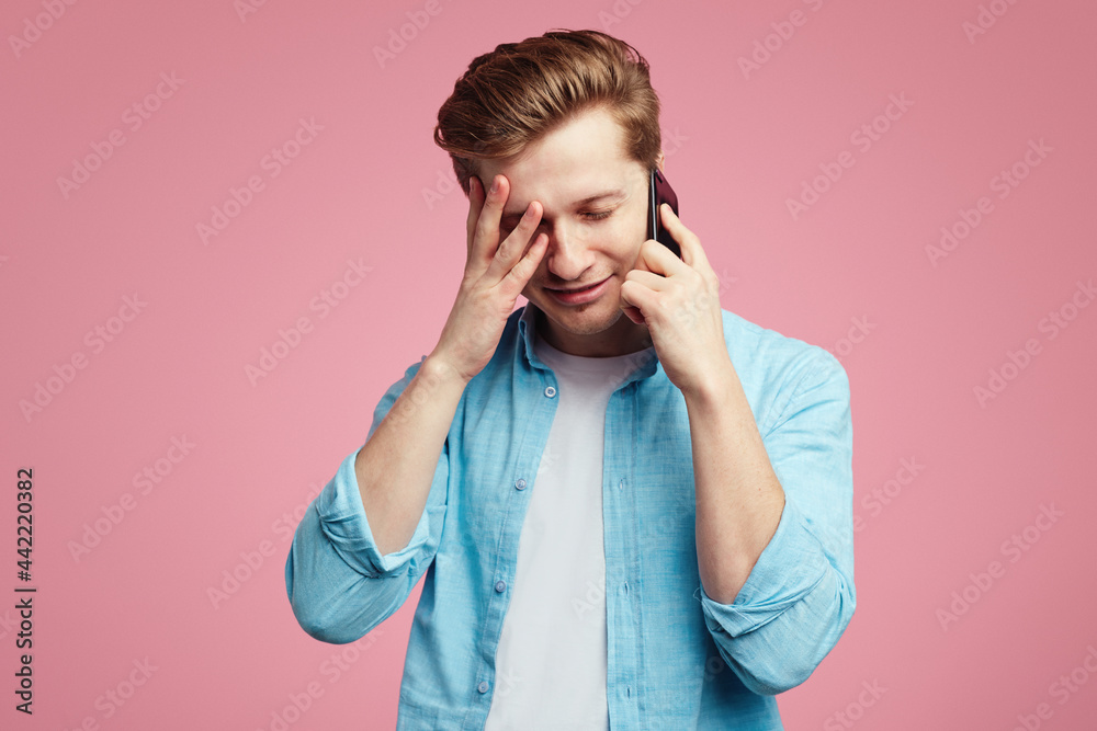 Dissatisfied unhappy man has unpleasant phone conversation Dissatisfied unhappy man has unpleasant phone conversation