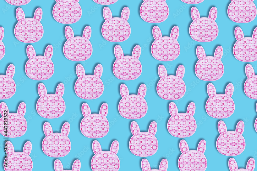 Seamless pattern of silicone antistress pop it toys on blue background. Banner. Flat lay. Seamless pattern of silicone antistress pop it toys on blue background. Banner. Flat lay.