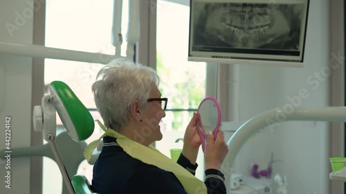 Short hair senior smiling at the dentist 