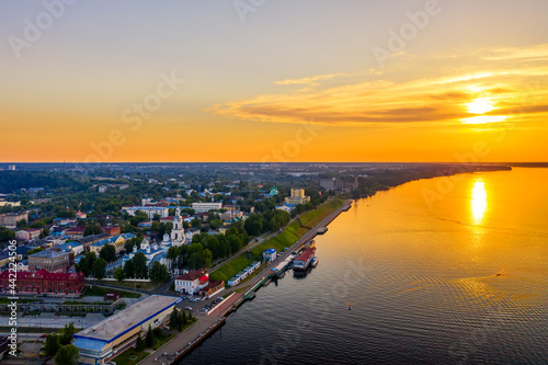 Aerial drone view of Kineshma ancient city with Volga river in Ivanovo region, Russia. Summer sunny day sunset