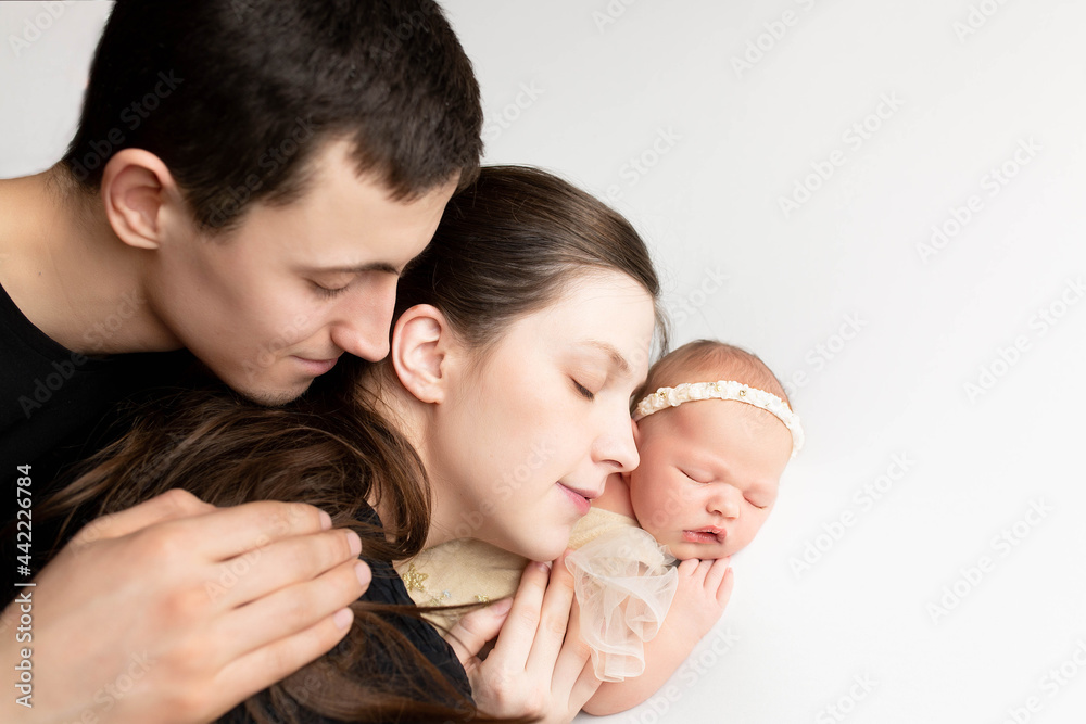 family portrait. mother and father with newborn baby. mom, dad and kids