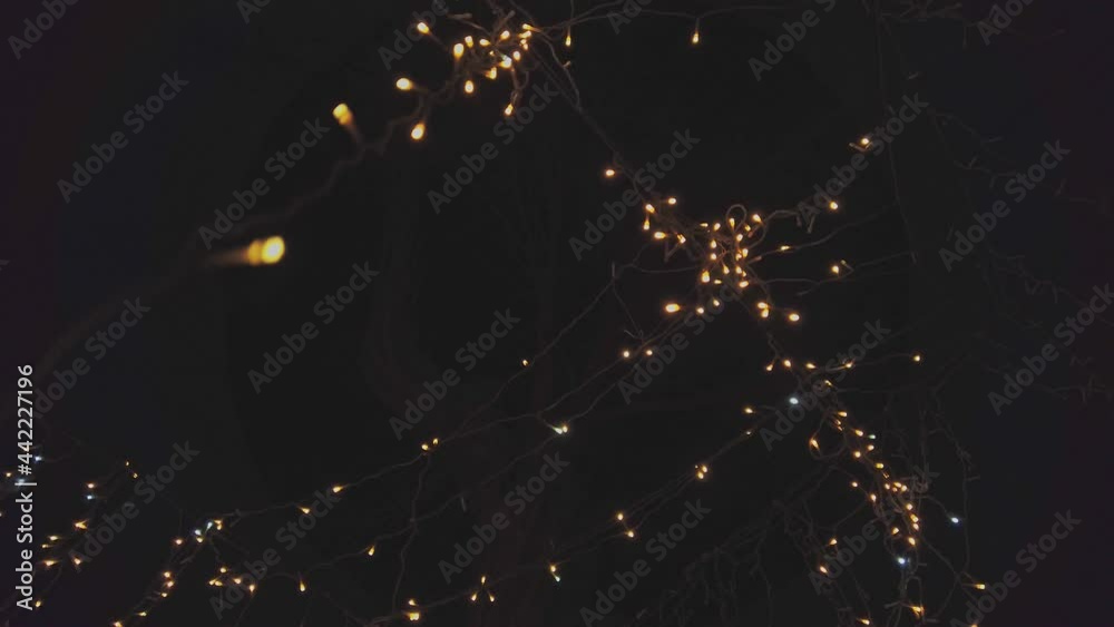 Garland lights decoration on the dark sky background. Garland lights decoration on the dark sky background.