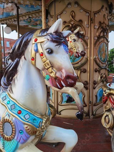 Closeup of a horse figure, traditional colorful carrousel.