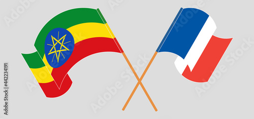 Crossed and waving flags of Ethiopia and France