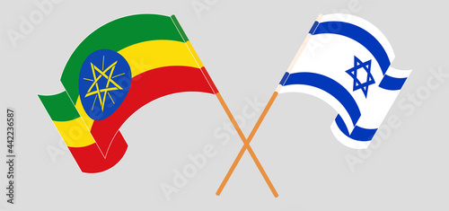 Crossed and waving flags of Ethiopia and Israel