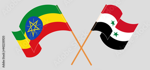 Crossed and waving flags of Ethiopia and Syria