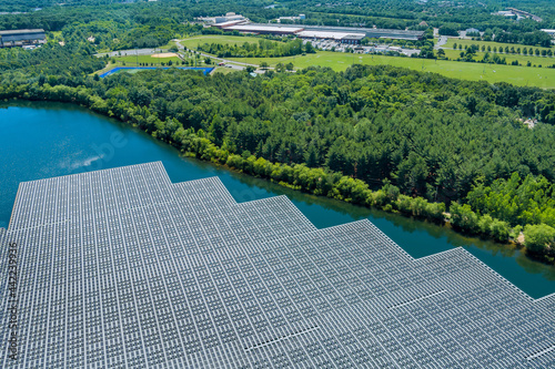 Panels floating on water with floating solar panels in a blue pond under the sunlight
