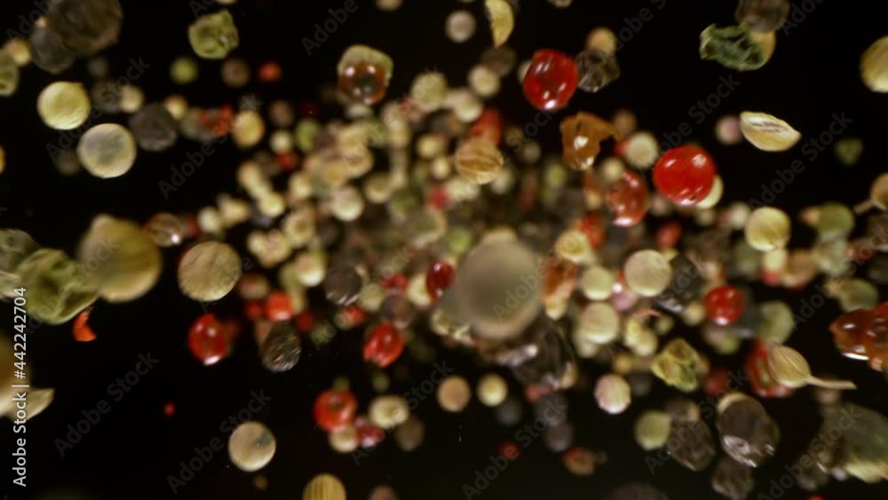 Super Slow Motion Detail Shot of Color Pepper Flying Towards Camera at 1000fps. Super Slow Motion Detail Shot of Color Pepper Flying Towards Camera at 1000fps.