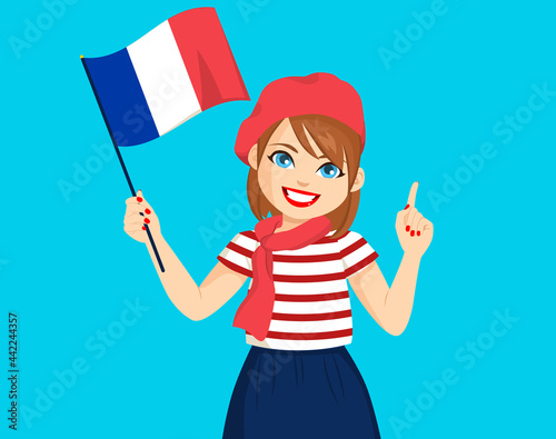 Beautiful young french woman holding France flag wearing fashion clothes