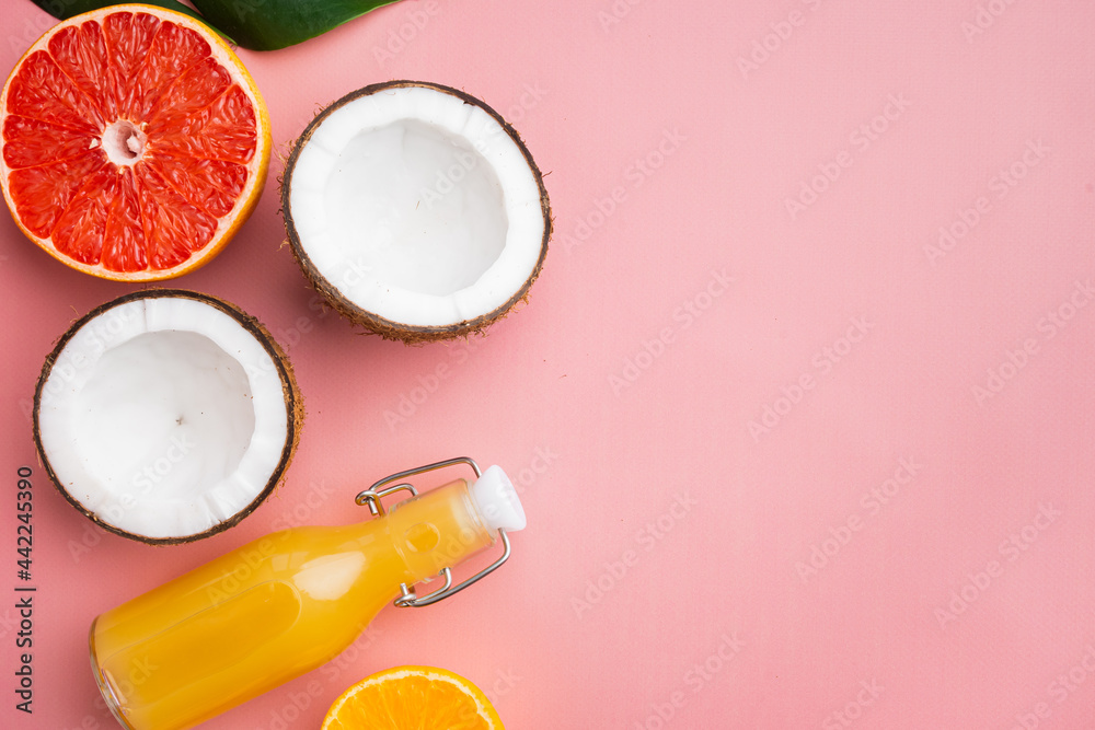 Tropical fruit , on pink textured summer background, top view flat lay, with copy space for text