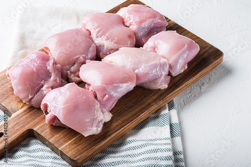 Raw skinless  chicken meat on white background photo