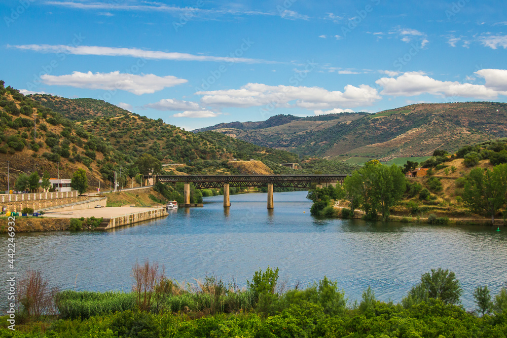 Steel bridge over the Douro river, Portugal. Natural Park of the Douro river with beautiful mountain and river landscapes