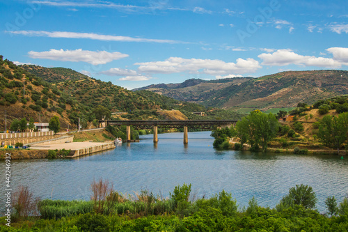 Steel bridge over the Douro river, Portugal. Natural Park of the Douro river with beautiful mountain and river landscapes © WildGlass Photograph