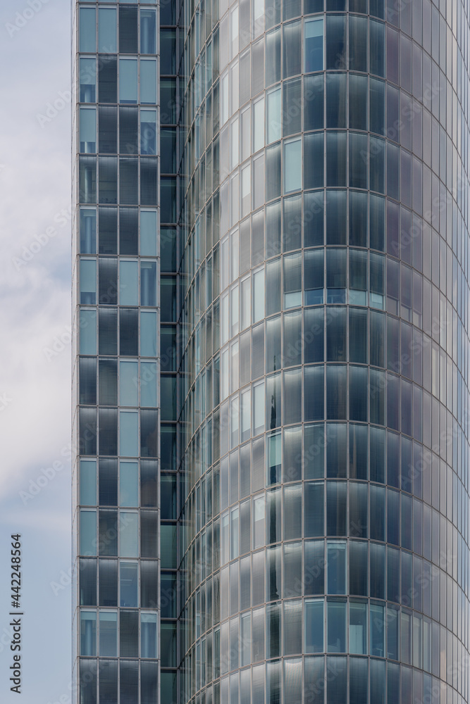 Close up detail of modern glass facade with rectangular windows frame system of office building. Abstract Architectural Geometry elements with urban metropolis concept. Close up detail of modern glass facade with rectangular windows frame system of office building. Abstract Architectural Geometry elements with urban metropolis concept.