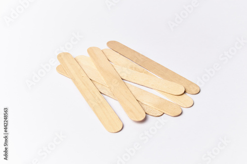 Tongue depressors isolated on white, also called abatelenguas or bajalenguas used by medical professionals for examination or for popsicles sticks