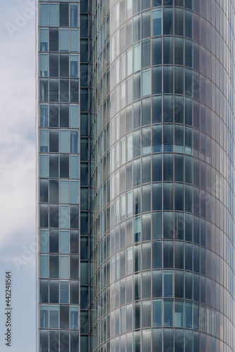 Close up detail of modern glass facade with rectangular windows frame system of office building. Abstract Architectural Geometry elements with urban metropolis concept.