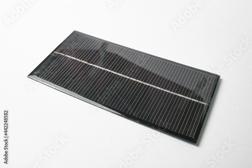 Photovoltaic solar energy planel isolated on white, sustainable electricity from sunlight