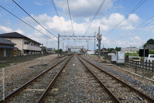 Railroad from the rail crossing near Tomita Station in Ashikaga, Tochigi, Japan. June 24, 2021