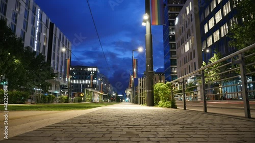 Oslo Bjørvika Norway - Timelapse evening of Dronning Eufemias Gate with dark and fast moving clouds and city lights and rainbow flag - Date taken: june 25 2021