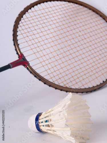 used badminton racket and shuttlecock © AgusDLaksono