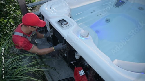 Hot Tub SPA Technician Checking on Jacuzzi Filter photo