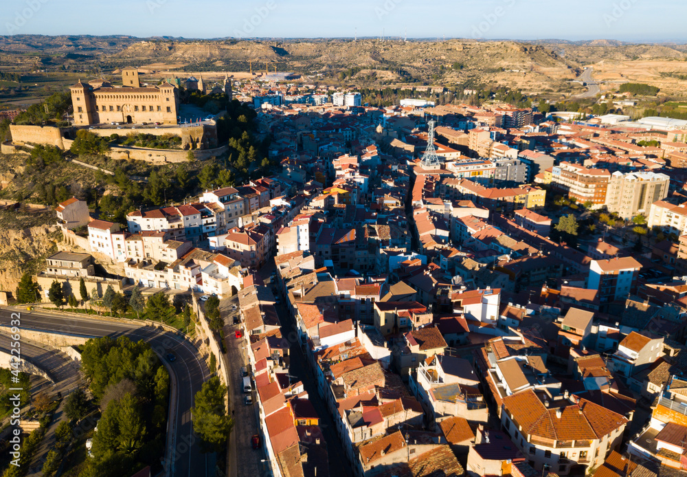 Aerial view of impressive medieval castle of Order of Calatrava on hill in town of Alcaniz, Spain