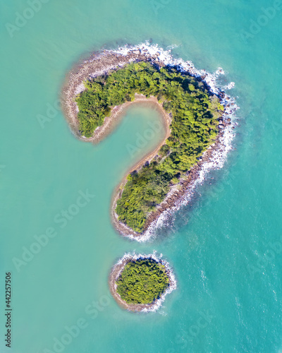 Question Mark Symbol Green Island Drone Aerial Montage with Boat in Turquoise Ocean Sea Symbolic Image with Copy Space No Buildings Isolated