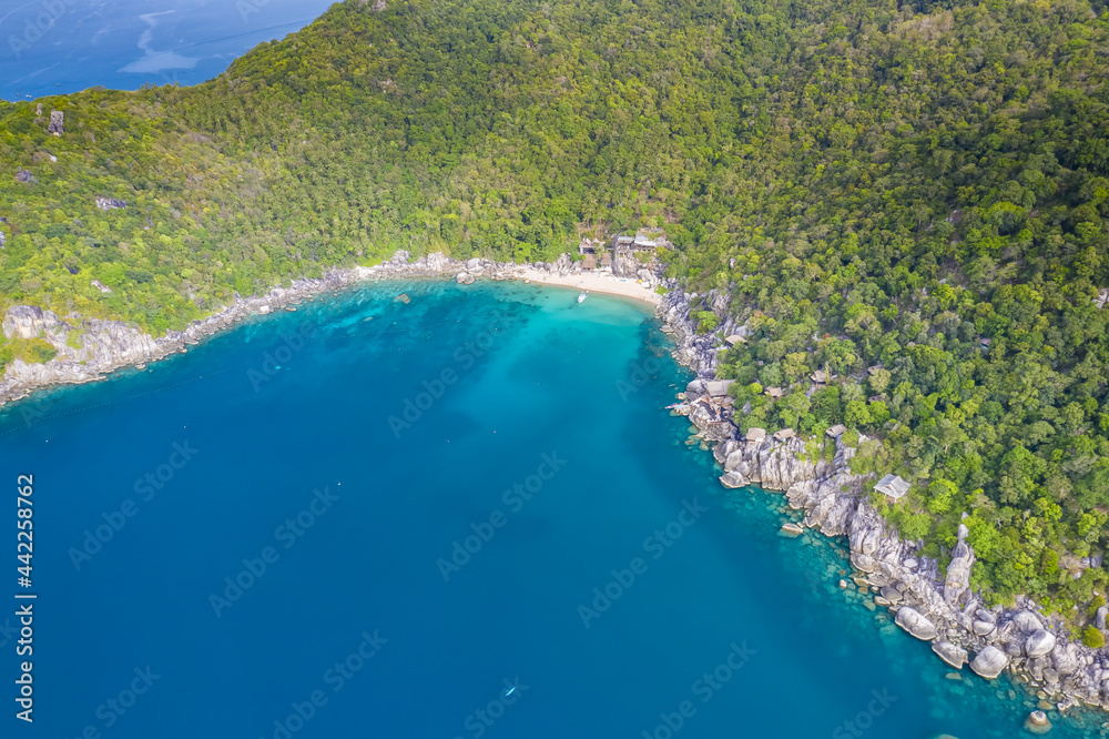 Clean Clear Blue Ocean Sea Water with rocks beach no people copy space paradise tropical island beautiful Koh Tao Thailand drone ariel aerial uav