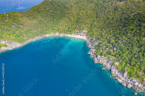 Clean Clear Blue Ocean Sea Water with rocks beach no people copy space paradise tropical island beautiful Koh Tao Thailand drone ariel aerial uav