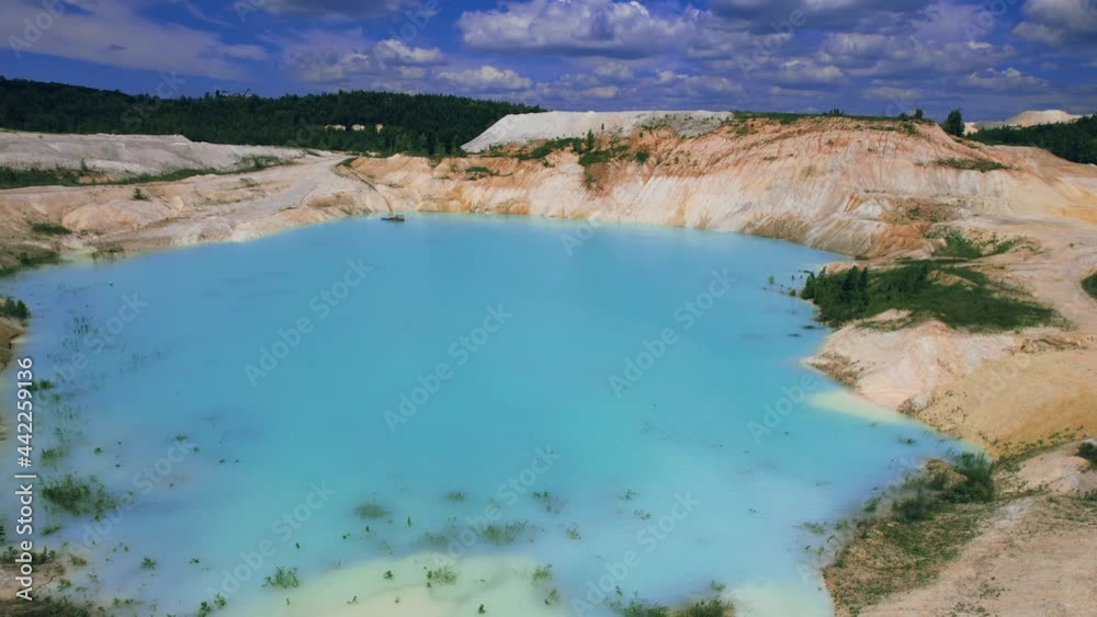 Amazing industrial landscape. Drone view of opencast mine. Emerald artificial pond. 4k stock footage. Amazing industrial landscape. Drone view of opencast mine. Emerald artificial pond. 4k stock footage.