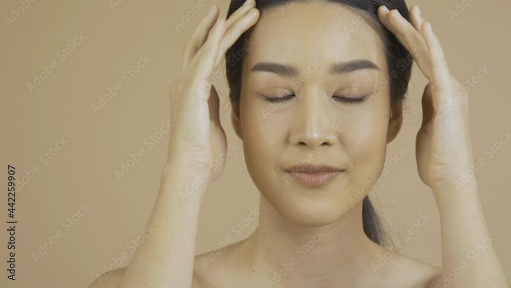 Beauty and Mackup concept, Portrait of Beautiful woman with perfect makeup iat Studio. She touching her face with attractive smiling. Beauty and Mackup concept, Portrait of Beautiful woman with perfect makeup iat Studio. She touching her face with attractive smiling.