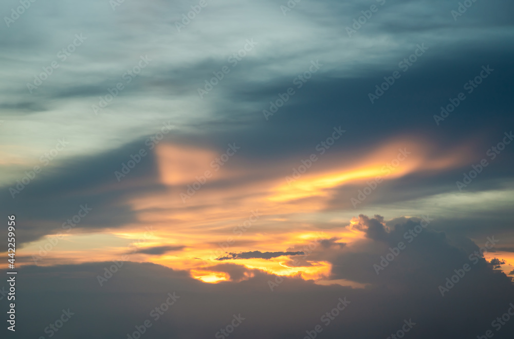 Beautiful sunset sky above clouds with dramatic light, Beautiful blazing sunset landscape, Copy space, Selective focus.